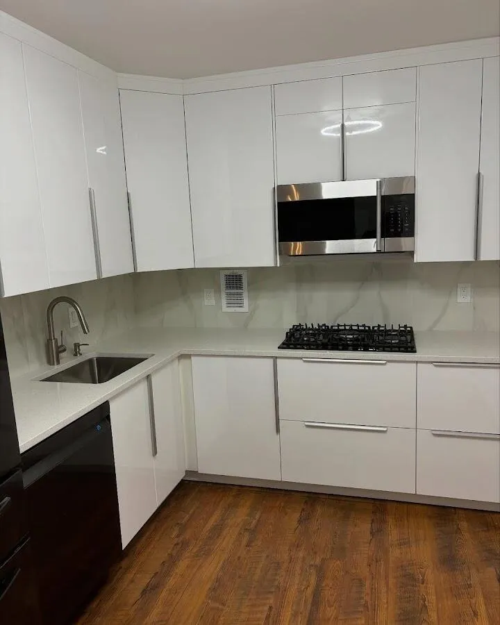 Restored kitchen with white cabinets after water damage in New Haven